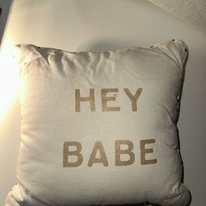 White Pillow with Gold Text 'HEY BABE'